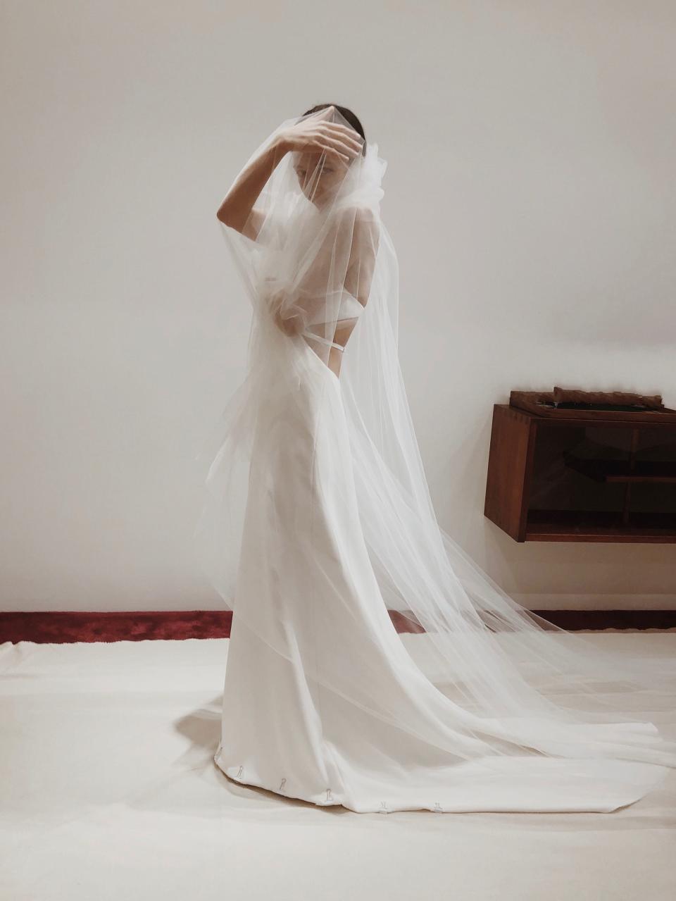 I was having a lot of fun with the veil, and my sister snapped this photo. As a stylist, it was so strange to be on this side of the fitting, but I really soaked up every second.