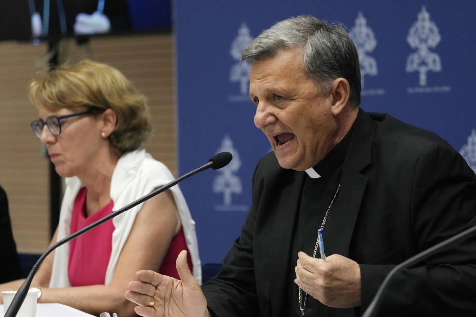 Secretary General of the Synod of Bishops Cardinal Mario Grech, right, delivers his speech during a presentation of the new guidelines for the Synod of Bishops at the Vatican, Tuesday, June 20, 2023. (AP Photo/Domenico Stinellis)