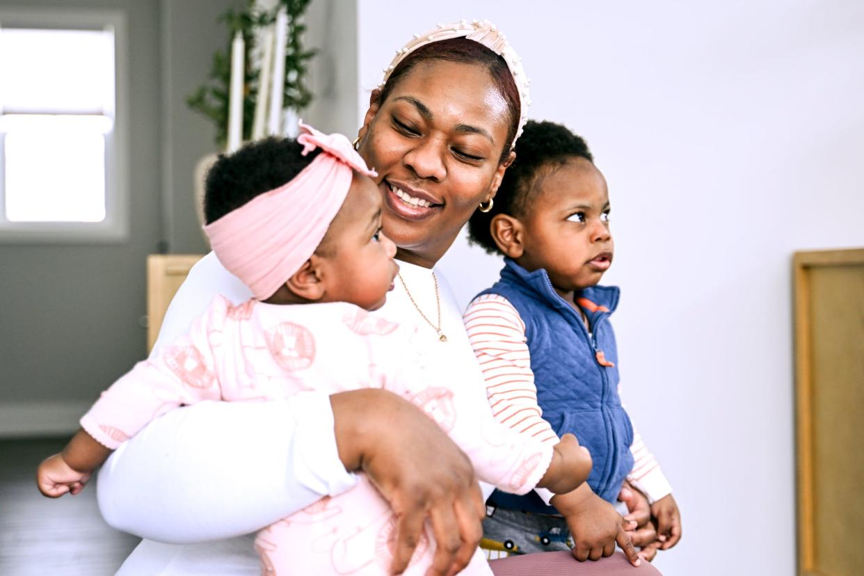 Chelena Bell with her daughter, left, and son, on Friday, March 22, 2024, at their home in Holt. Bell used a doula to assist with the births of the two youngest children.