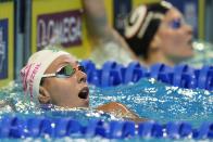 Abbey Weitzeil after winning the women's 100 freestyle during wave 2 of the U.S. Olympic Swim Trials on Friday, June 18, 2021, in Omaha, Neb. (AP Photo/Jeff Roberson)