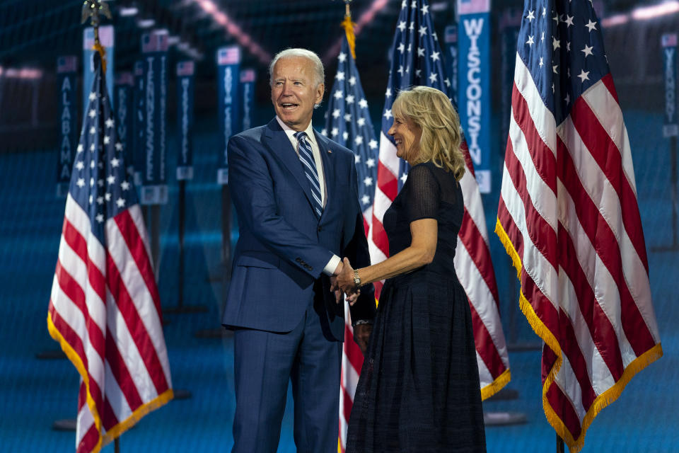 FILE - In this Aug. 19, 2020, file photo Democratic presidential candidate former Vice President Joe Biden, and his wife Jill Biden, take the stage after Democratic vice presidential candidate Sen. Kamala Harris, D-Calif., spoke during the third day of the Democratic National Convention at the Chase Center in Wilmington, Del. (AP Photo/Carolyn Kaster, File)