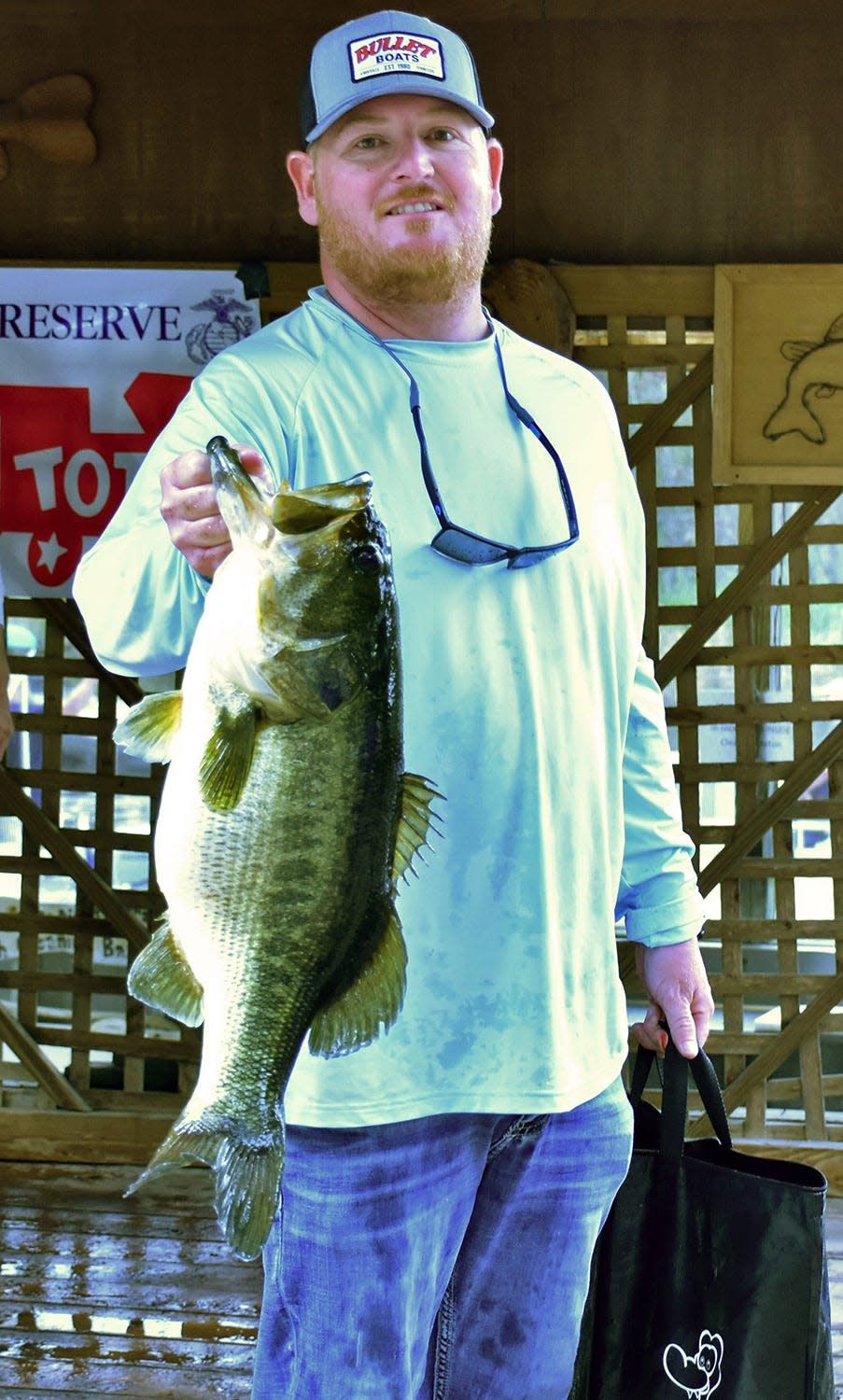 Brian Dutcher won big bass with this 8.24 pounder to help him and his partners Matthew Rittman, Seth Slanker and Jackson Swisher to a total weight of 43.11 pounds to win the Eighth Annual Toys for Tots 4-Man Team Open Tournament Dec. 5. at Lake Kissimmee.