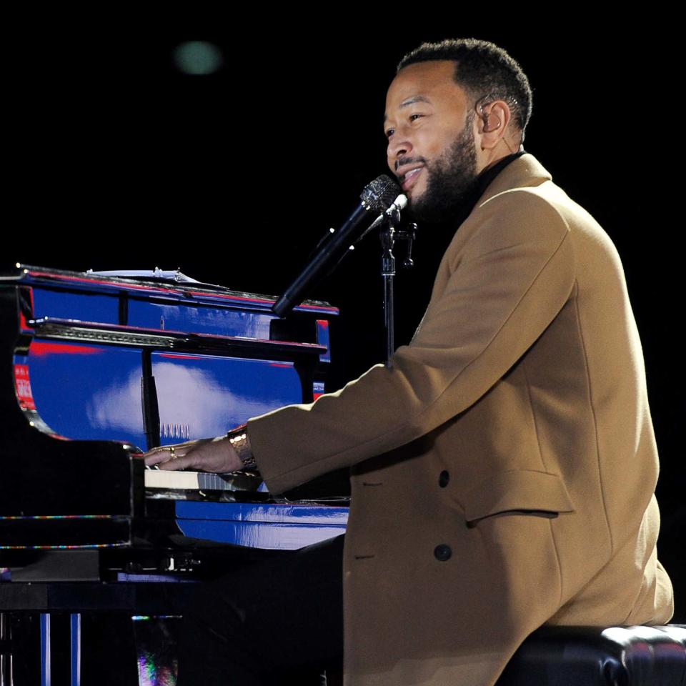 John Legend plays the piano during a drive-in get out the vote rally in Philadelphia on Nov. 2.