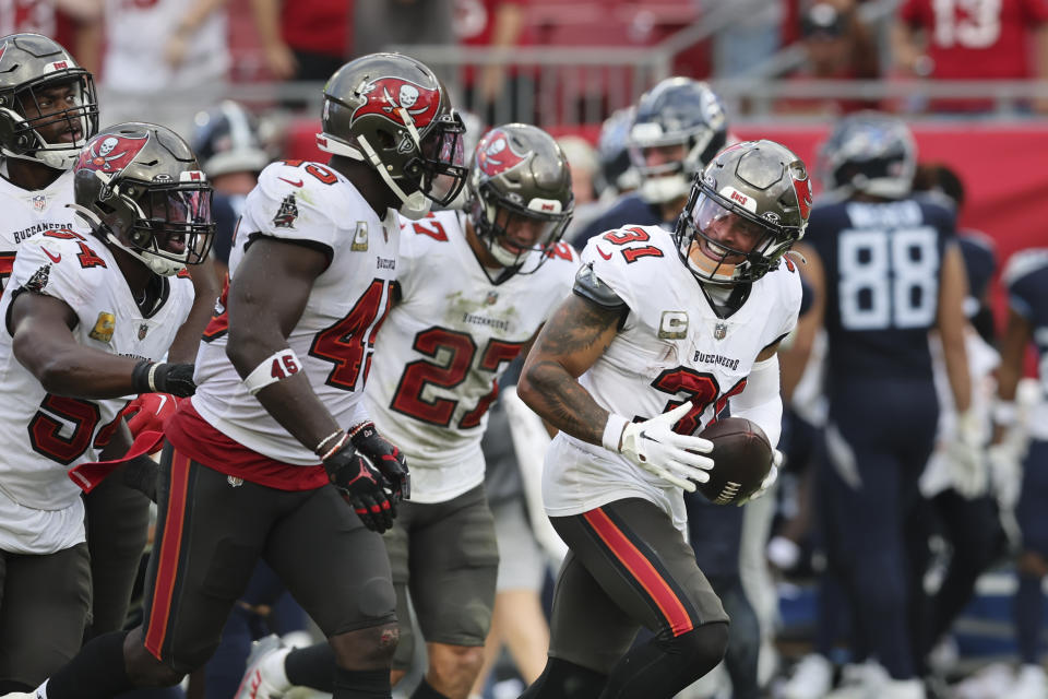 Tampa Bay Buccaneers safety Antoine Winfield Jr. (31) celebrates an interception with teammates during the second half of an NFL football game against the Tennessee Titans, Sunday, Nov. 12, 2023, in Tampa, Fla. (AP Photo/Mark LoMoglio)