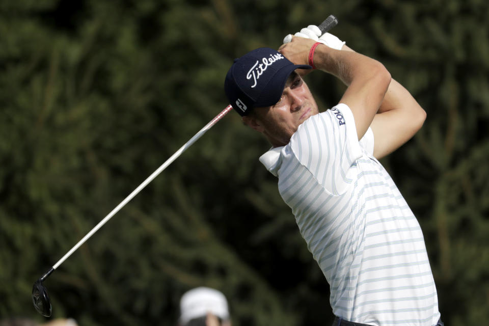 FILE - In this Thursday, Aug. 23, 2018 file photo, Justin Thomas tees off on the 14th hole during the first round of the Northern Trust golf tournament in Paramus, N.J. Tiger Woods finished off the PGA Tour season by tapping in for par to win the Tour Championship, a moment that ended any doubts that he could win again after four surgeries on his lower back. And then the moment was gone as the Ryder Cup began. Overlooked from last season was Justin Thomas being first player to win consecutive money titles since Woods, and Woods winning a fifth tournament in three decades. (AP Photo/Julio Cortez, File)