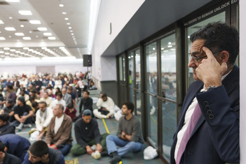 President and co-founder of the Muslim Public Affairs Council, Salam Al-Marayati, far right, gets ready to address American Muslims after a prayer in Los Angeles Wednesday, April 10, 2024. As the war in Gaza enters its seventh month, some Muslim and Arab American leaders have grown frustrated with outreach from President Joe Biden's White House. Marayati described the attitude as, “Forget them. They have to learn a lesson. And if they lose, that’s the lesson they should learn.” (AP Photo/Damian Dovarganes)