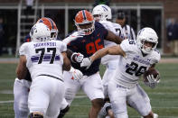 Northwestern running back Evan Hull (26) carries the ball past a block from offensive lineman Peter Skoronski during the first half of an NCAA college football game against Illinois Saturday, Nov. 27, 2021, in Champaign, Ill. (AP Photo/Charles Rex Arbogast)