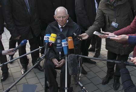 German Finance Minister Wolfgang Schaueble talks to reporters ahead of an extraordinary euro zone Finance Ministers meeting to discuss Athens' plans to reverse austerity measures agreed as part of its bailout, in Brussels February 11, 2015. REUTERS/Yves Herman