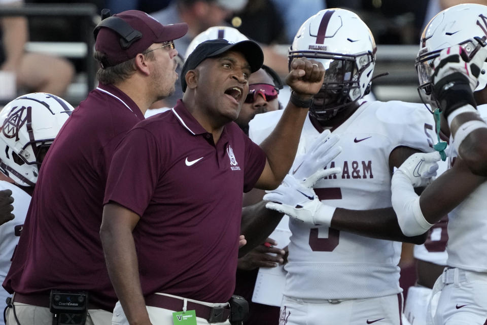 Alabama A&M head coach Connell Maynor, front left, yells to his players in the first half of an NCAA college football game against Vanderbilt, Saturday, Sept. 2, 2023, in Nashville, Tenn. (AP Photo/Mark Humphrey)