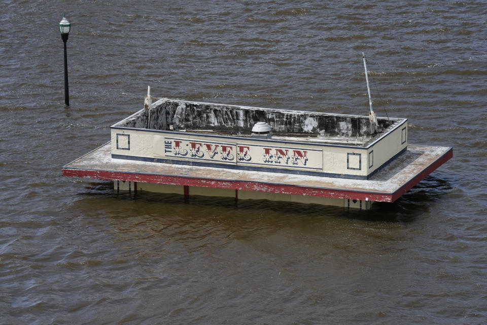 A snack shop sits in floodwaters from the nearby Mississippi River, Monday, May 1, 2023, in downtown Davenport, Iowa. The rising Mississippi River is testing flood defenses in southeast Iowa and northwest Illinois as it nears forecast crests in the area Monday, driven by a spring surge of water from melting snow. (AP Photo/Charlie Neibergall)