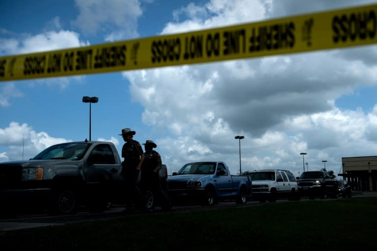 Officers escorted students and staff back onto Santa Fe High School property but only to collect any valuable or vehicles, as an investigation continued after the murder of 10 students and teachers
