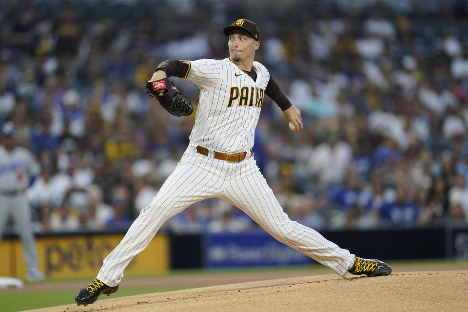 San Diego Padres starting pitcher Blake Snell works against a Los Angeles Dodgers batter during the first inning of a baseball game Wednesday, Aug. 25, 2021, in San Diego. (AP Photo/Gregory Bull)