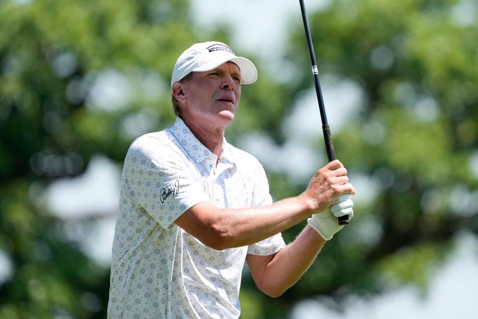 Steve Stricker hits off the third tee during the first round of the Champions Tour Principal Charity Classic golf tournament, Friday.  He held the lead after the opening round of the competition.