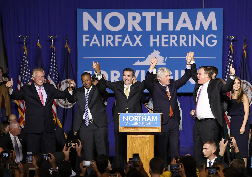 <span class="s1">Gov.-elect Ralph Northam, center, links arms with current Gov. Terry McAuliffe, Lt. Gov.-elect Justin Fairfax, Attorney General Mark Herring and U.S. Sen. Mark Warner at an election night rally. (Photo: Win McNamee/Getty Images)</span>