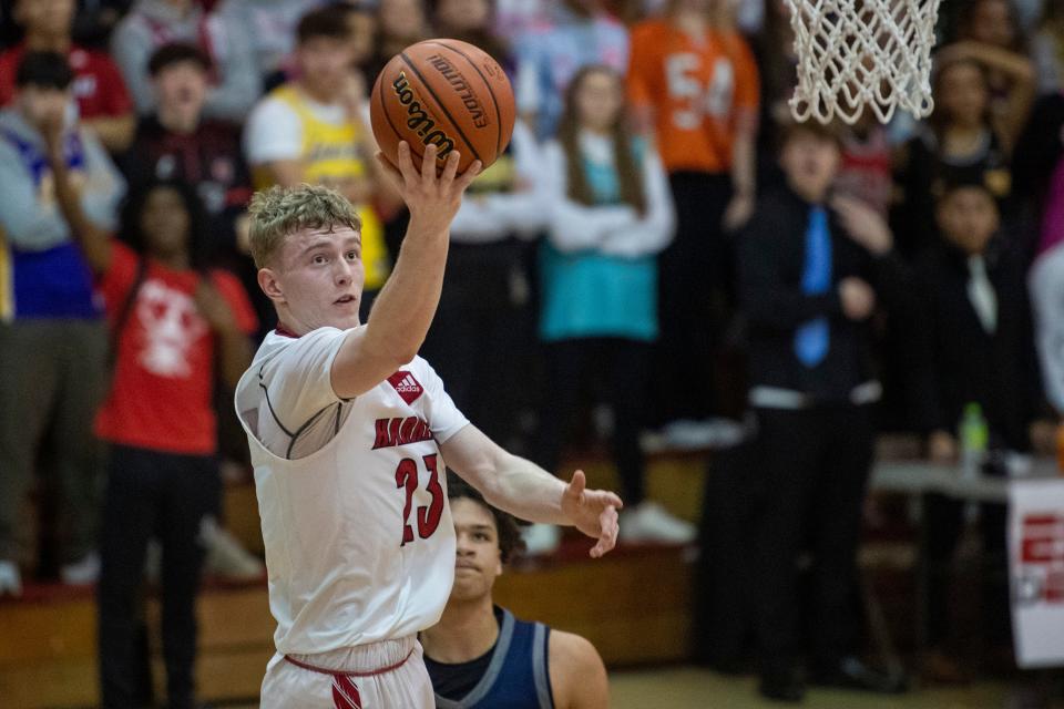 Harrison’s Shane Sims (23) puts up shot as the Harrison Warriors play the Reitz Panthers  at Harrison High School in Evansville, Ind., Friday, Feb. 10, 2023. 