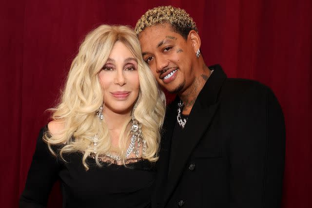 <p>Kevin Mazur/Getty Images</p> Cher and Alexander Edwards at the Warner Music Group Pre-Grammy Party on Feb. 1, 2024 in Los Angeles