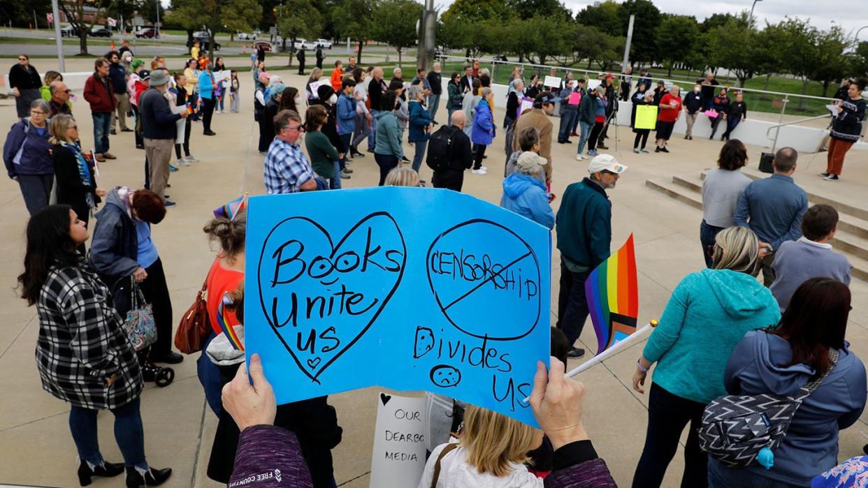 demonstrators gather to protest against banning books outside of the henry ford centennial library in dearborn, michigan, on september 25, 2022 the protests emerged after dearborn public schools temporarily restricted access to seven books following a parent's complaint about their content they also restricted access to an e book app featuring thousands of titles photo by jeff kowalsky afp photo by jeff kowalskyafp via getty images