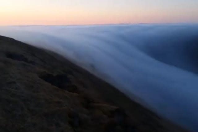 'Fog river' seen rolling off a clifftop in Iceland (video)