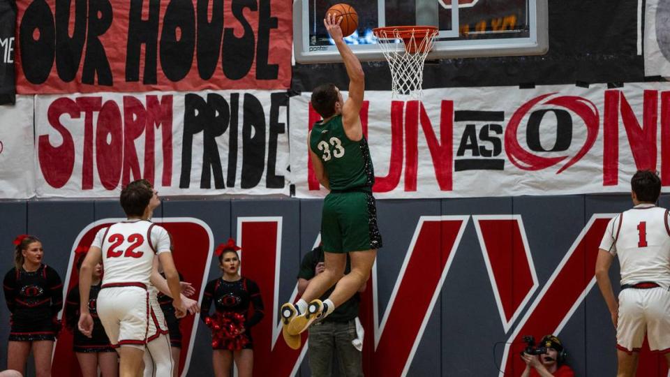 Eagle forward Cal Huish dunks against Owyhee in the “Battle of the Bolt” rivalry game Jan. 16 at Owyhee High.