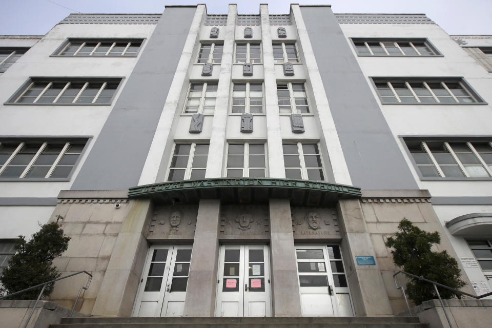 FILE - In this March 12, 2020, file photo, George Washington High School stands in San Francisco. The San Francisco school board has voted to remove the names of George Washington and Abraham Lincoln from public schools after officials deemed them and other prominent figures, including Sen. Dianne Feinstein unworthy of the honor. After months of controversy, the board voted 6-1 Tuesday, Jan. 26, 2021, in favor of renaming 44 San Francisco school sites with new names with no connection to slavery, oppression, racism or similar criteria, the San Francisco Chronicle reported. (AP Photo/Jeff Chiu, File)