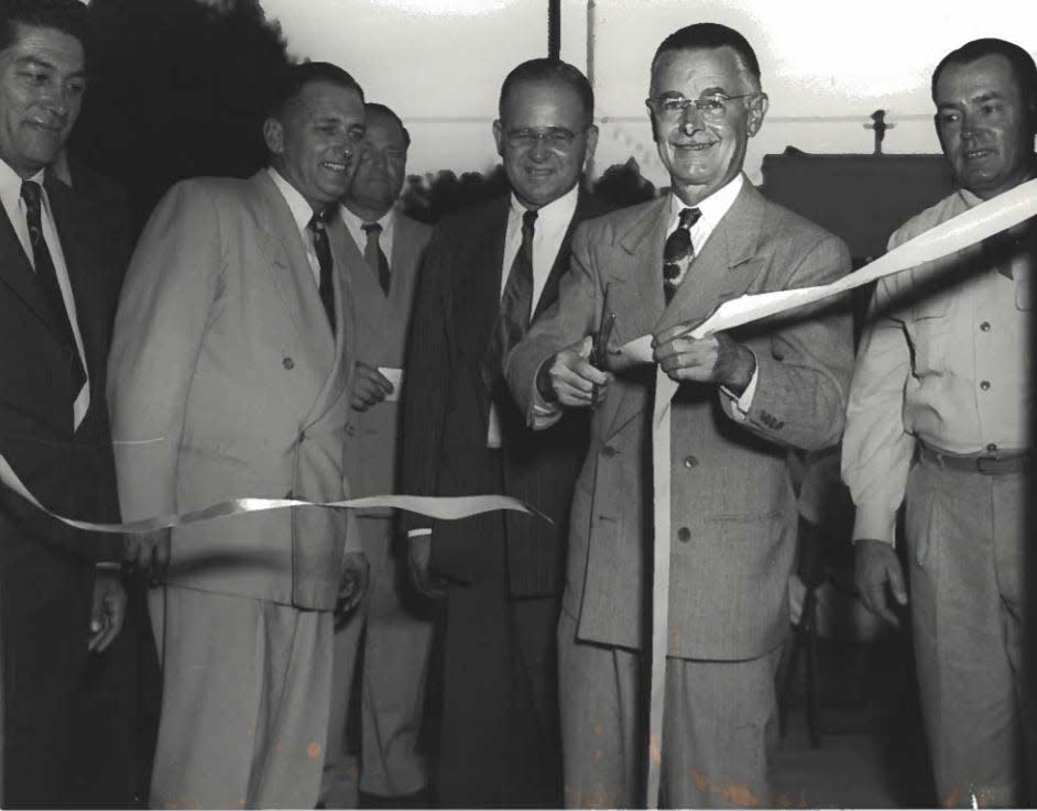 Coachella's first mayor, John W. Westerfield, cuts the ribbon at the opening of City Hall on Oct. 29, 1949.