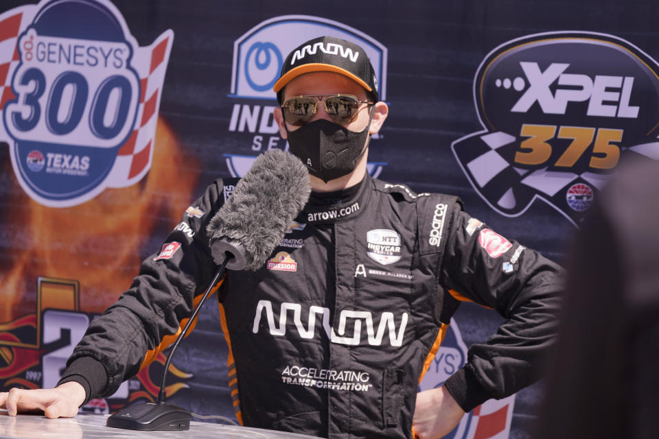 Pato O'Ward of Mexico speaks to reporters after driving during IndyCar auto race testing at Texas Motor Speedway in Fort Worth, Texas, Wednesday, March 31, 2021. (AP Photo/LM Otero)