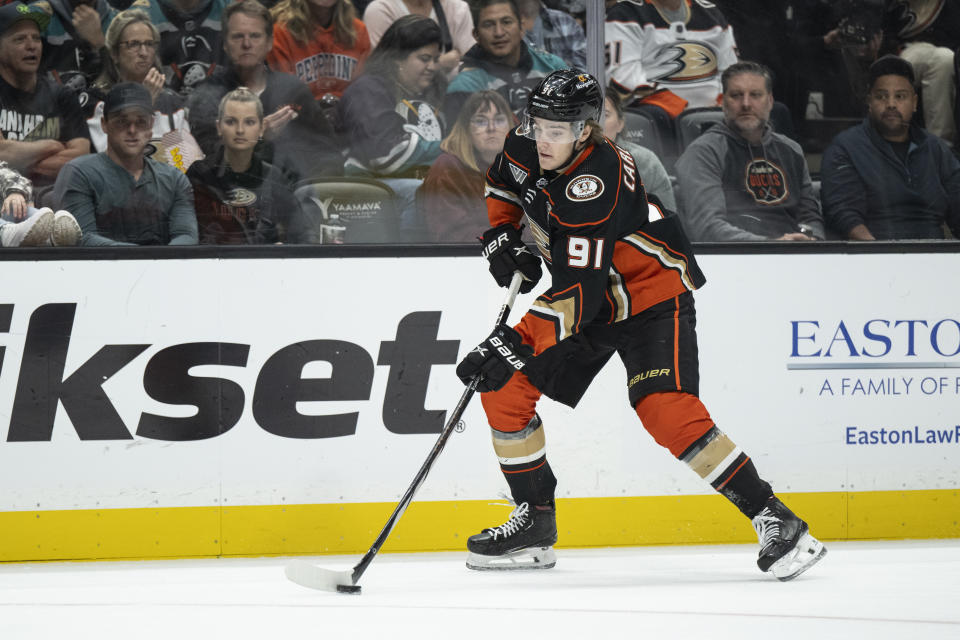 Anaheim Ducks center Leo Carlsson (91) controls the puck during the first period of an NHL hockey game against the Dallas Stars, Thursday, Oct. 19, 2023, in Anaheim, Calif. (AP Photo/Kyusung Gong)