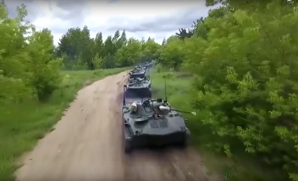 In this frame grab taken from video provided by Russian Defense Ministry Press Service on Tuesday, Sept. 11, 2018, Russian armored personnel carriers roll during the military exercises in the Chita region, Eastern Siberia, during the Vostok 2018 exercises in Russia. Russia's military chief of staff says that the military exercises expected to be the biggest in three decades, will involve nearly 300,000 troops. (Russian Defense Ministry Press Service pool photo via AP)