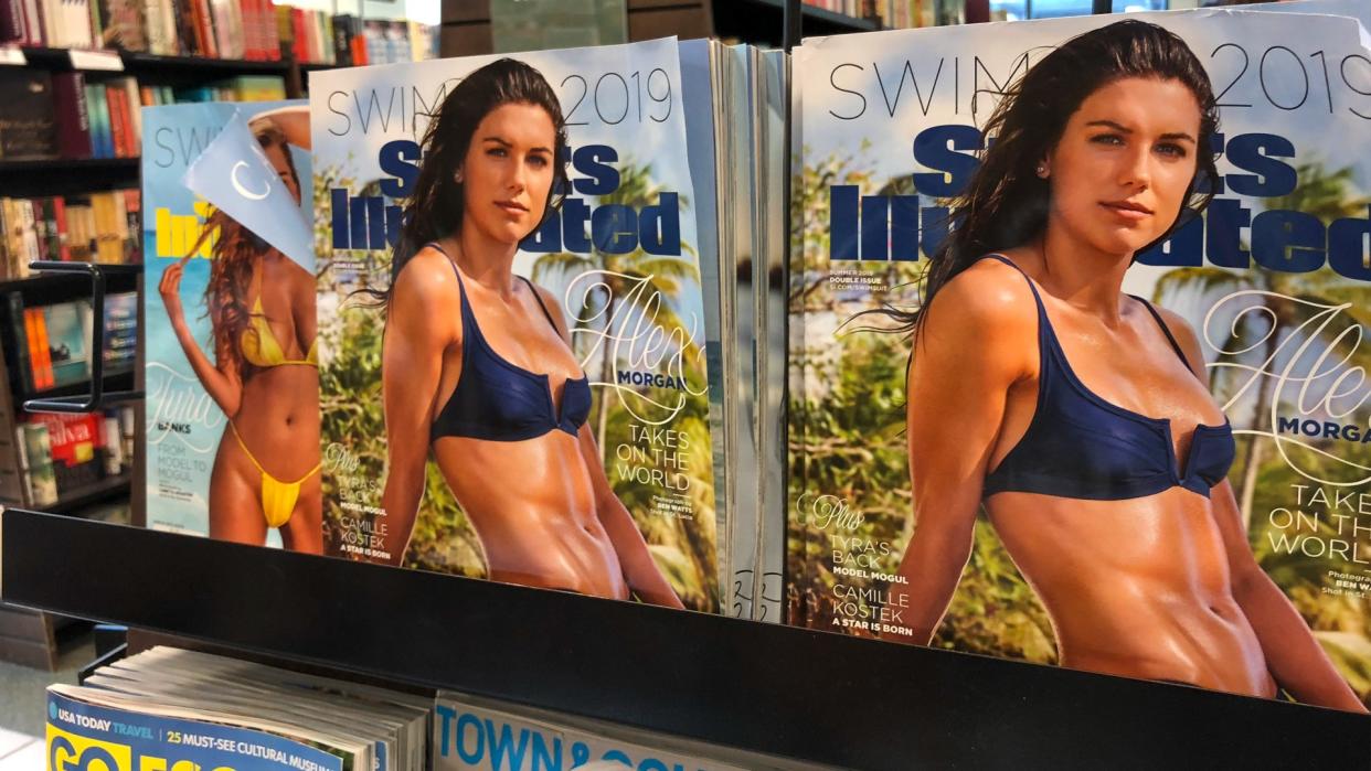  A magazine rack with copies of Sports Illustrated. 