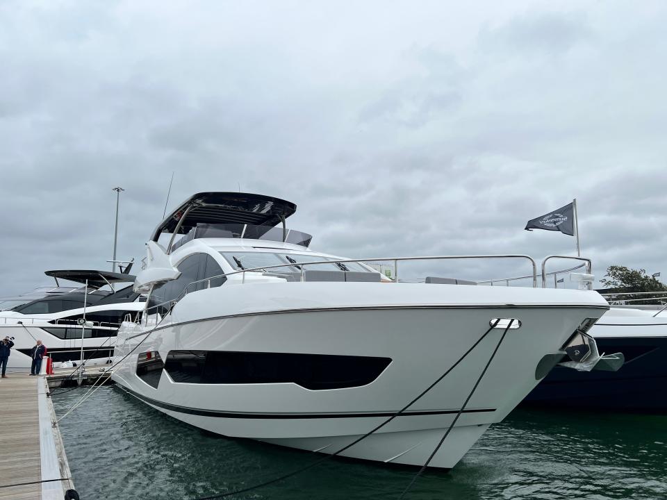 A three-quarters front view of the Sunseeker 76 yacht on a cloudy day