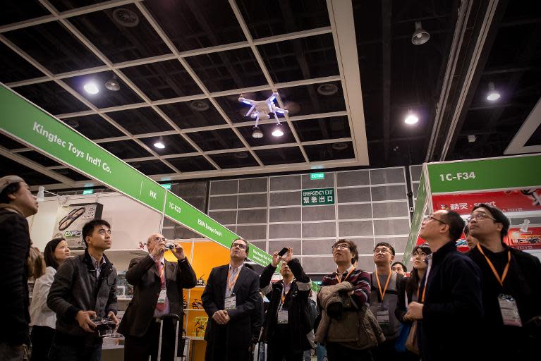 An exhibitor flies a drone at the 40th Toys and Games Fair in Hong Kong, on January 8, 2014