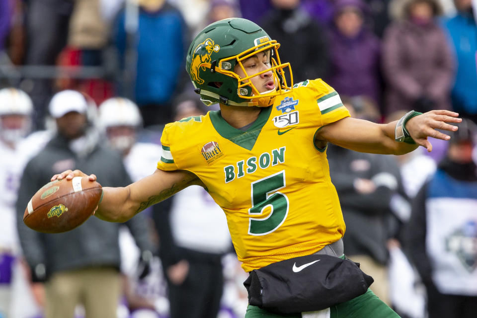 FILE - In this Saturday, Jan. 11, 2020 file photo, North Dakota State quarterback Trey Lance (5) winds up to throw during the first half of the FCS championship NCAA college football game against James Madison in Frisco, Texas. The NFL announced last month that some of the top prospects were being invited to Cleveland. The league is hoping to incorporate some of the city’s best-known locations along Lake Erie: FirstEnergy Stadium, home of the Browns; and the Rock & Roll Hall of Fame. (AP Photo/Sam Hodde, File)