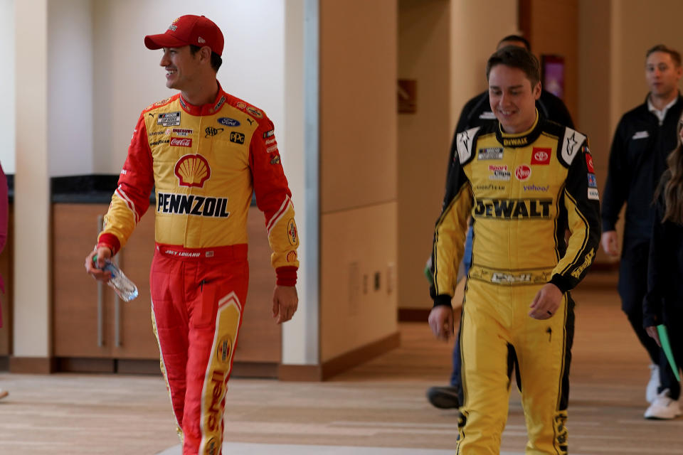 NASCAR Cup Series drivers Joey Logano, left, and Christopher Bell arrive at the NASCAR Championship media day, Thursday, Nov. 3, 2022, in Phoenix. (AP Photo/Matt York)