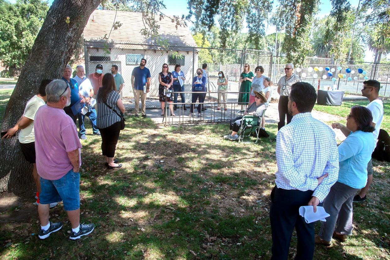 Area residents discuss the renovation of the swimming pool at Victory Park in Stockton.