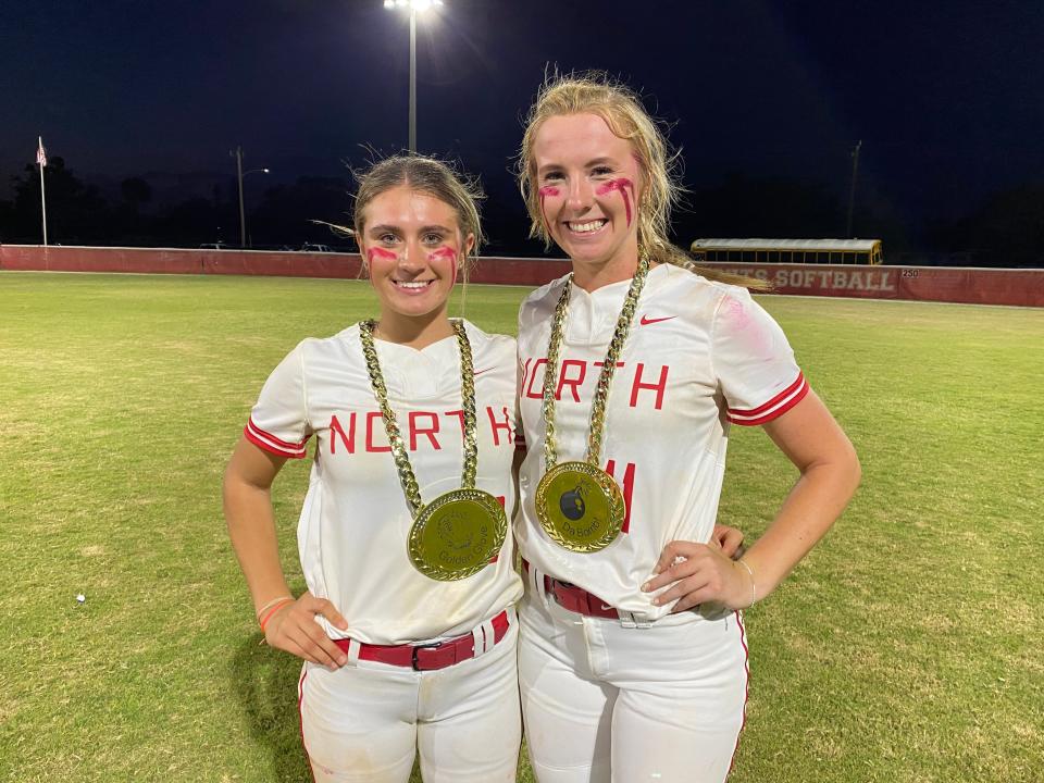 North Fort Myers players Mia Lane and Kendall Wylie pose after their team's win 3-0 against Bishop Verot on April 25, 2023.
