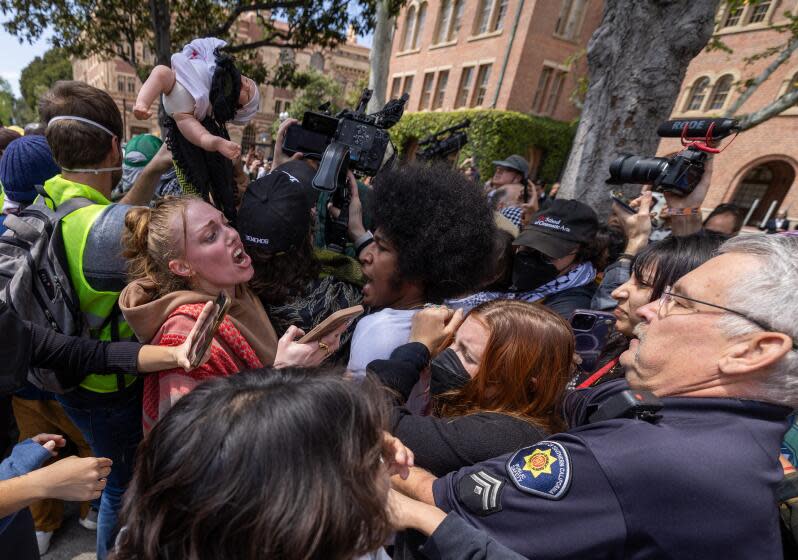 April 24: Public safety officers confront pro-Palestinian demonstrators on the USC campus on April 24, 2024