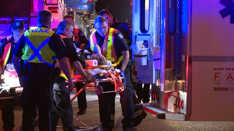 New Westminster crash traps woman in car