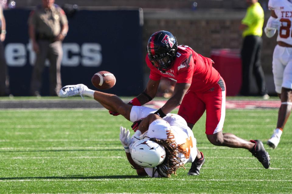 Texas Tech cornerback Rayshad Williams (0) breaks up a pass for Texas wide receiver Jordan Whittington (4) during the Red Raiders' 37-34 overtime victory last year at Jones AT&T Stadium. Texas Tech visits Tech on Nov. 24 in the Longhorns' last regular-season football game as a Big 12 member.