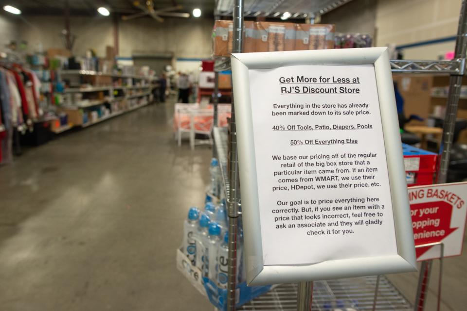 A sign informs customers of the pricing model used at RJ's Discount Store. According to the sign, tools, patio, diapers and pools are marked 40% off while everything else is 50% off.