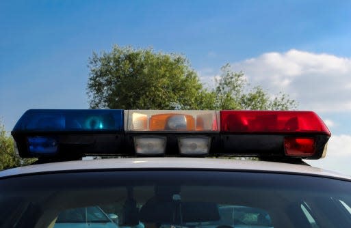 Lights sit atop a police car.