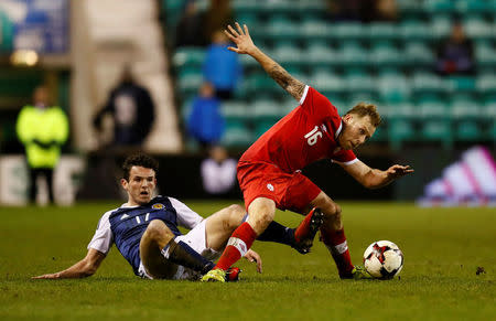 Britain Football Soccer - Scotland v Canada - International Friendly - Easter Road, Edinburgh, Scotland - 22/3/17 Canada’s Scott Arfield in action with Scotland’s John McGinn Action Images via Reuters / Jason CairnduffLivepic