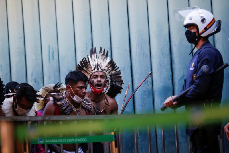 Indigenous Brazilians from different ethnic groups take part in a protest to defend demarcation of indigenous lands, in Brasilia