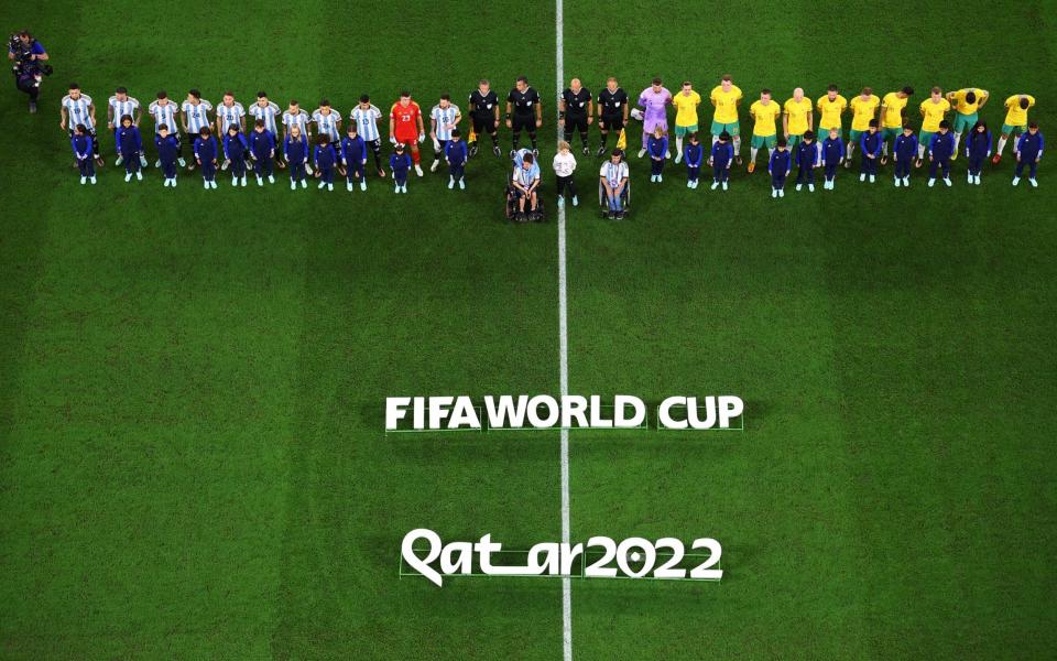 The teams line up during the national anthems before the match - Reuters