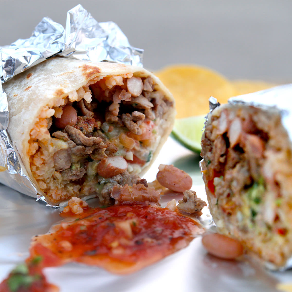 foil wrapped burrito cut in half