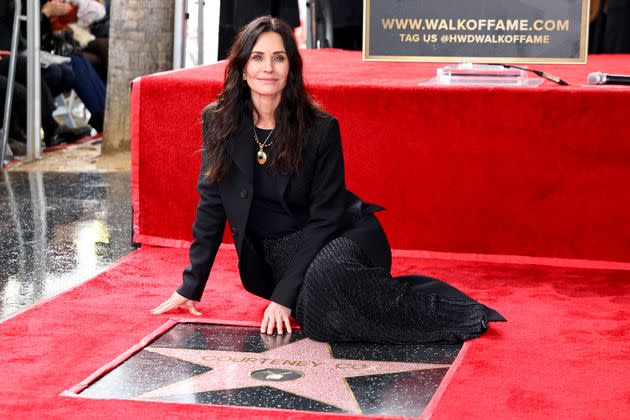 Courteney posing with her Walk Of Fame star