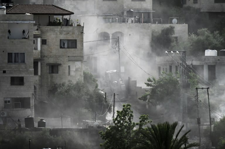 Smoke billowed over the refugee camp in Jenin after an Israeli raid killed at least seven Palestinians (RONALDO SCHEMIDT)