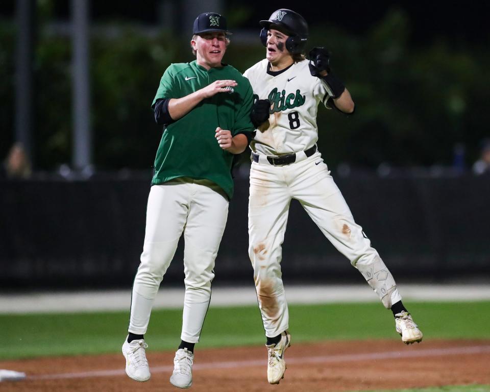 Neumann Celtics baserunner Nick Frontino (8) celebrates with his team after hitting an RBI to trigger the mercy rule and end the game during the fifth inning of a game against the Riverdale Raiders at St. John Neumann High School in Naples on Monday, March 11, 2024. Neumann won 12-2.