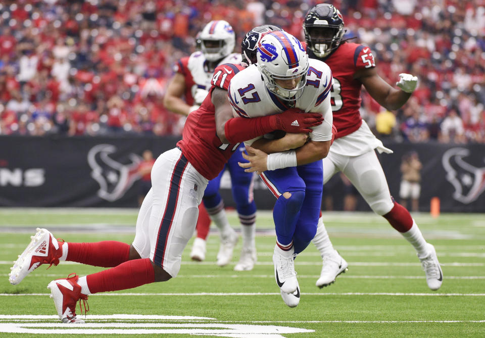 Buffalo Bills quarterback Josh Allen (17) is hit by Houston Texans linebacker Zach Cunningham (41) during the second half of an NFL football game, Sunday, Oct. 14, 2018, in Houston. (AP Photo/Eric Christian Smith)