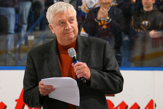 <p>Bill Wippert/NHLI via Getty Images</p> Broadcaster Rick Jeanneret of the Buffalo Sabres speaks to the crowd before their game against the Montreal Canadiens at HSBC Arena on October 15, 2010 in Buffalo, New York.