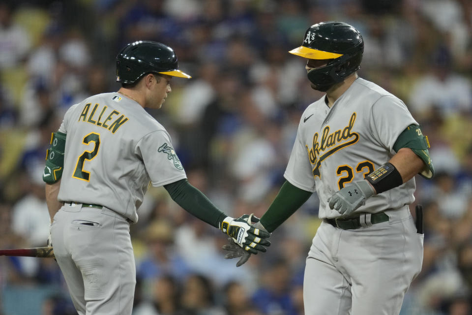 Oakland Athletics' Shea Langeliers (23) celebrates with Nick Allen (2) after hitting a home run during the third inning of a baseball game against the Los Angeles Dodgers in Los Angeles, Wednesday, Aug. 2, 2023. (AP Photo/Ashley Landis)